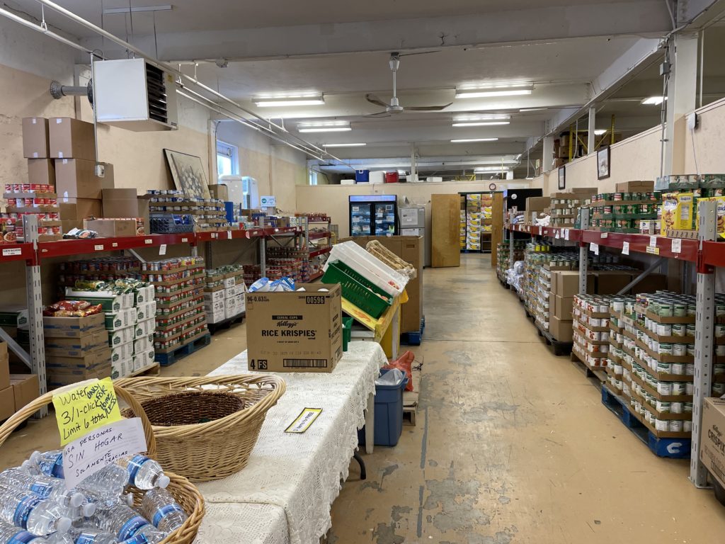 The food pantry at Care and Share. Funds to be used for another glass front refrigerator like the one on far back wall in this picture.