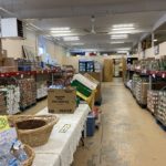 The food pantry at Care and Share. Funds to be used for another glass front refrigerator like the one on far back wall in this picture.