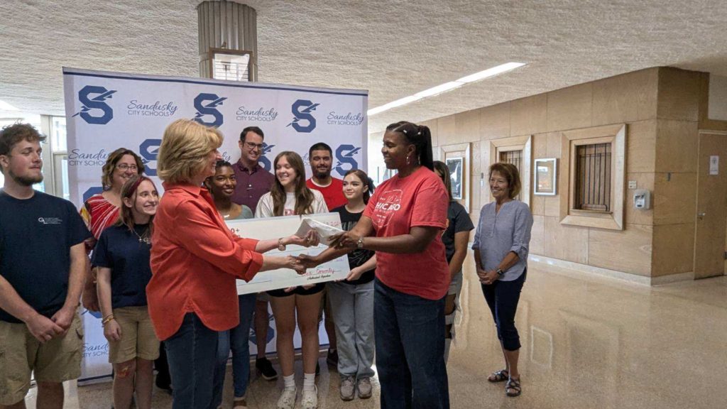 Roz accepting donation on behalf of HLVPAA at Sandusky High School